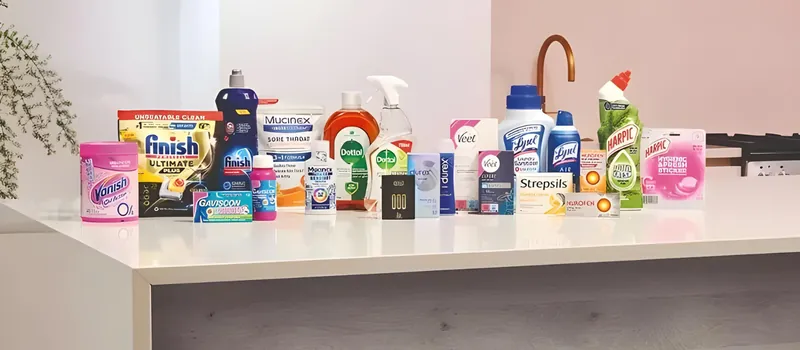 A range of branded cleaning and disinfectant products on a counter